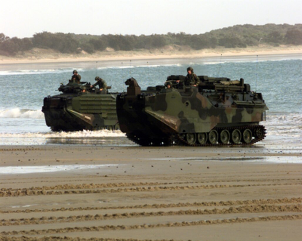 Two U.S. Marine Corps Amphibious Assault Vehicles emerge from the surf onto the sand of Freshwater Beach, Australia, during amphibious assault landing operations of Exercise Crocodile '99 on Oct. 1, 1999. Exercise Crocodile '99 is a combined U.S. and Australian military training exercise being conducted at the Shoalwater Bay Training Area in Queensland, Australia. 