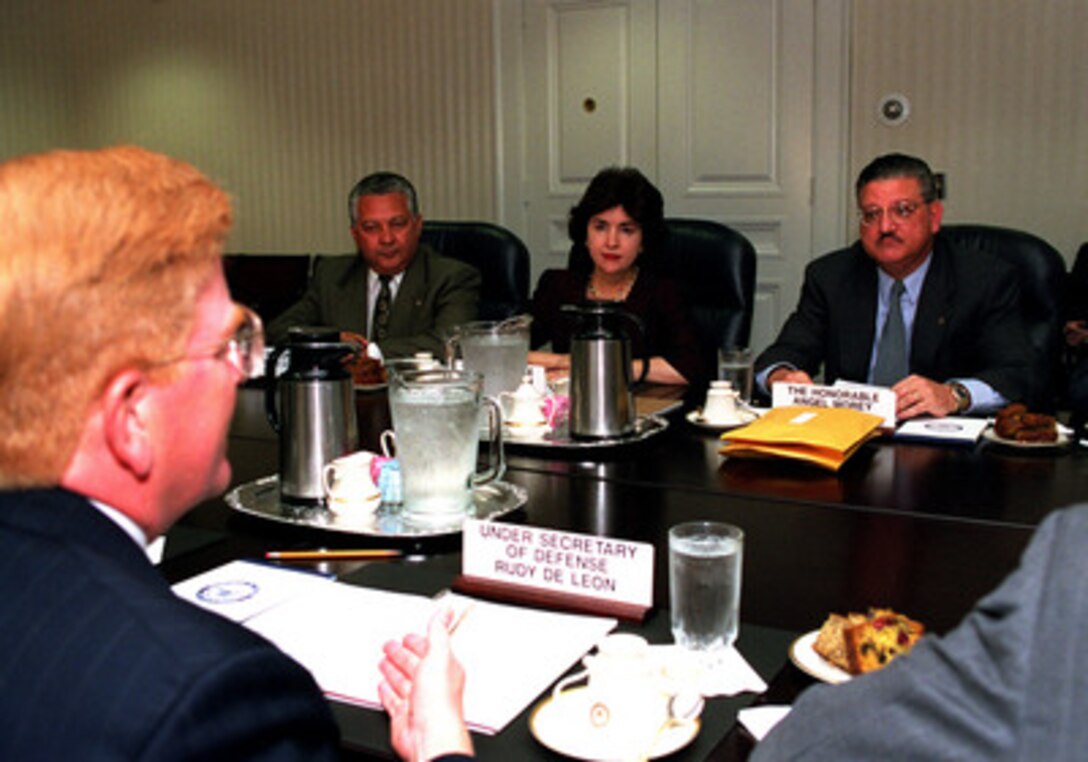 Members of the Puerto Rican Governor's Working Group on Vieques including Carlos Lopez (left), Sila Calderon (center) and Angel Morey meet in the Pentagon with Under Secretary of Defense Rudy DeLeon (foreground) on Sept. 13, 1999. 
