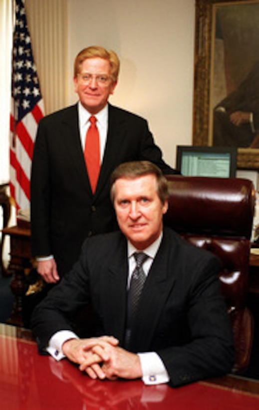 Secretary of Defense William S. Cohen (right) and Deputy Secretary of Defense Rudy de Leon (left) pose for an informal portrait in Cohen's Pentagon office on April 19, 2000. 