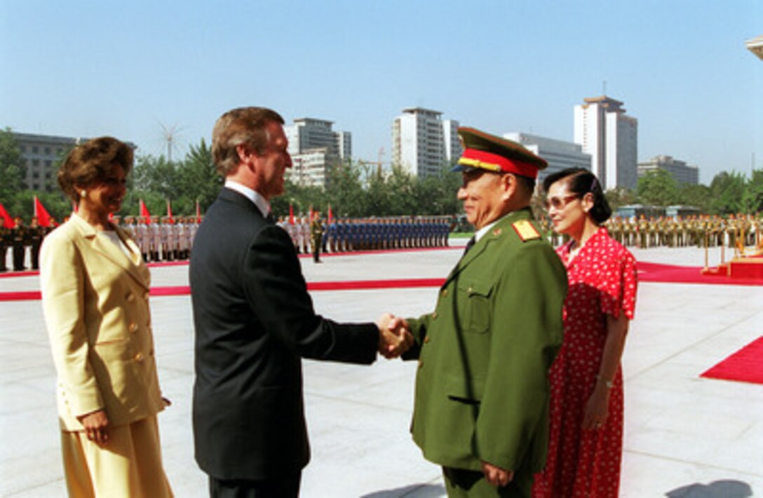 Secretary of Defense and Mrs. William S. Cohen (left) are greeted by Minister of National Defense Gen. and Mrs. Chi Haotian at the Ministry of National Defense Headquarters in Beijing, China, on July 12, 2000. Cohen is visiting Beijing, Shanghai and Sydney, Australia as part of a seven day trip to the Western Pacific. 