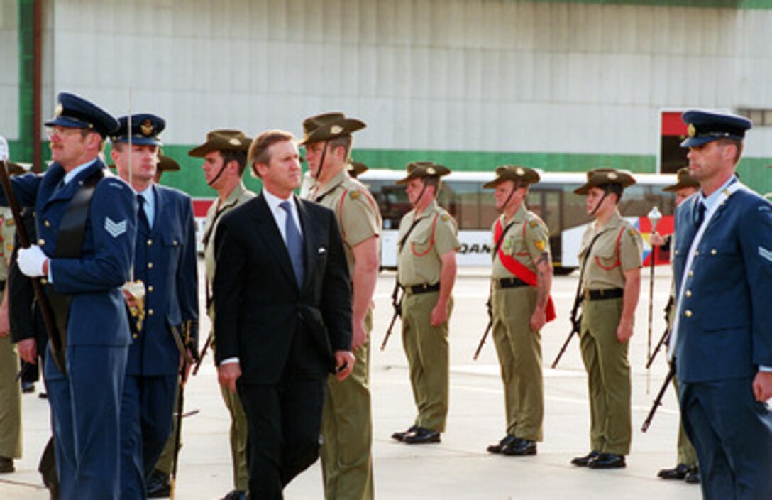Secretary of Defense William S. Cohen inspects the troops during an Australian Honor Guard Farewell ceremony at Sydney International Airport on July 17, 2000. Cohen is wrapping up a seven day trip to the Western Pacific. 