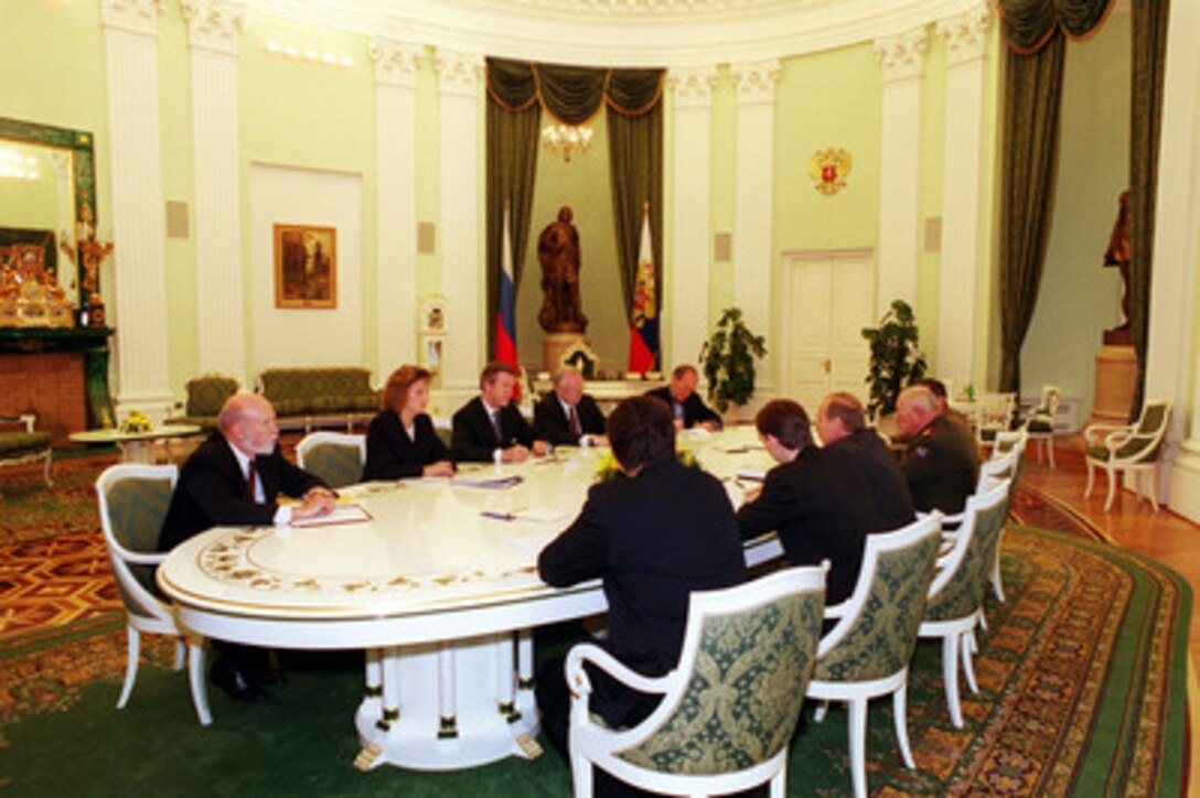 Secretary of Defense William S. Cohen (center, far-side) and U.S. Ambassador to the Russian Federation James F. Collins (Cohen's left) meet with Russian President Vladimir Vladimirovich Putin (3rd from left, near-side) and his Defense Minister Marshal Igor Dmitriyevich Sergeyev (Putin's right) at the Kremlin, in Moscow, Russia, on June 13, 2000, to discuss U.S. plans for developing an effective defense against a limited ballistic missile attack. Cohen is in Moscow during a seven-day European trip to meet with government officials and defense leaders. Joining Cohen at the table are Assistant Secretary of Defense (Strategy and Threat Reduction) Edward L. Warner (left), translator, and Assistant Secretary of Defense (Public Affairs) Kenneth H. Bacon (far right). 