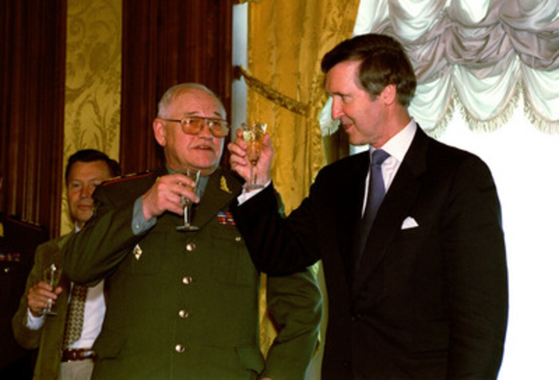 Secretary of Defense William S. Cohen (right) lifts his glass in a toast with Russian Defense Minister Marshal Igor Dmitriyevich Sergeyev at the Ministry of Defense building in Moscow, Russia, on June 13, 2000, following the signing of an agreement on military cooperation for the year 2000. The signing took place at the conclusion of several hours of talks between Cohen, Sergeyev and Russian President Vladimir Vladimirovich Putin. 