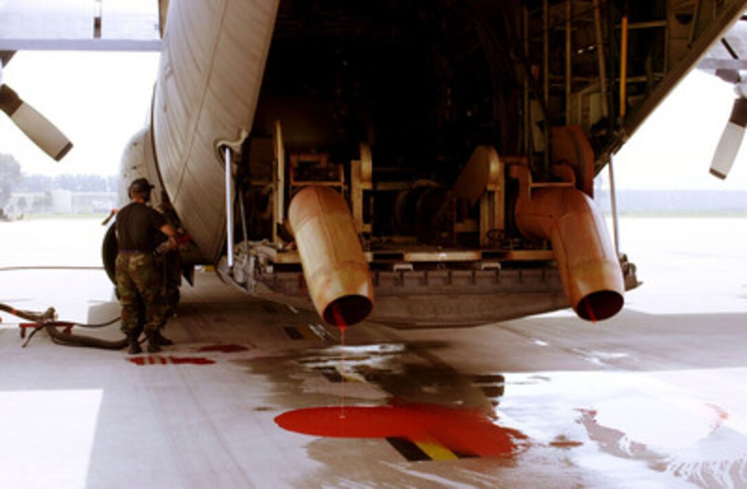 A C-130 Hercules gets a fresh charge of Phos-Chek fire retardant at the Channel Island Air National Guard Station, Calif., on July 31, 2000. The Hercules, equipped with the Modular Airborne Fire Fighting System, is being used on the Manter Fire in the Sequoia National Forest, Calif. More than 2,300 servicemembers from the Army, Marines, Air and Army Guard and Air Force Reserve are conducting firefighting and support operations for the Western wildfires in response to requests from the National Interagency Firefighting Center in Boise, Idaho, and as directed by the governors of several states. The Hercules is deployed to Channel Island from the 302nd Airlift Wing, Colorado Springs, Colo. 