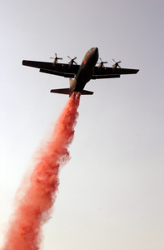 A C-130 Hercules equipped with the Modular Airborne Fire Fighting System streams a charge of Phos-Chek fire retardant on the Manter fire in California's Sequoia National Forest on July 31, 2000. More than 2,300 servicemembers from the Army, Marines, Air and Army Guard and Air Force Reserve are conducting firefighting and support operations for the Western wildfires in response to requests from the National Interagency Firefighting Center in Boise, Idaho, and as directed by the governors of several states. The Hercules is operating from the 146th Airlift Wing, Channel Island Air National Guard Station, Calif. 