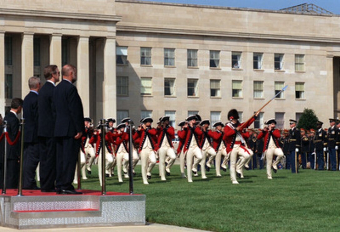 The U.S. Army's Old Guard Fife and Drum Corps passes in review during an armed forces full honors arrival ceremony at the Pentagon on Aug. 8, 2000, for Croatian President Stjepan Mesic (right) and Prime Minister Ivica Racan (left) hosted by Secretary of Defense William S. Cohen (center). Mesic, Racan and Cohen will later meet to discuss general regional security issues of interest to both nations. 