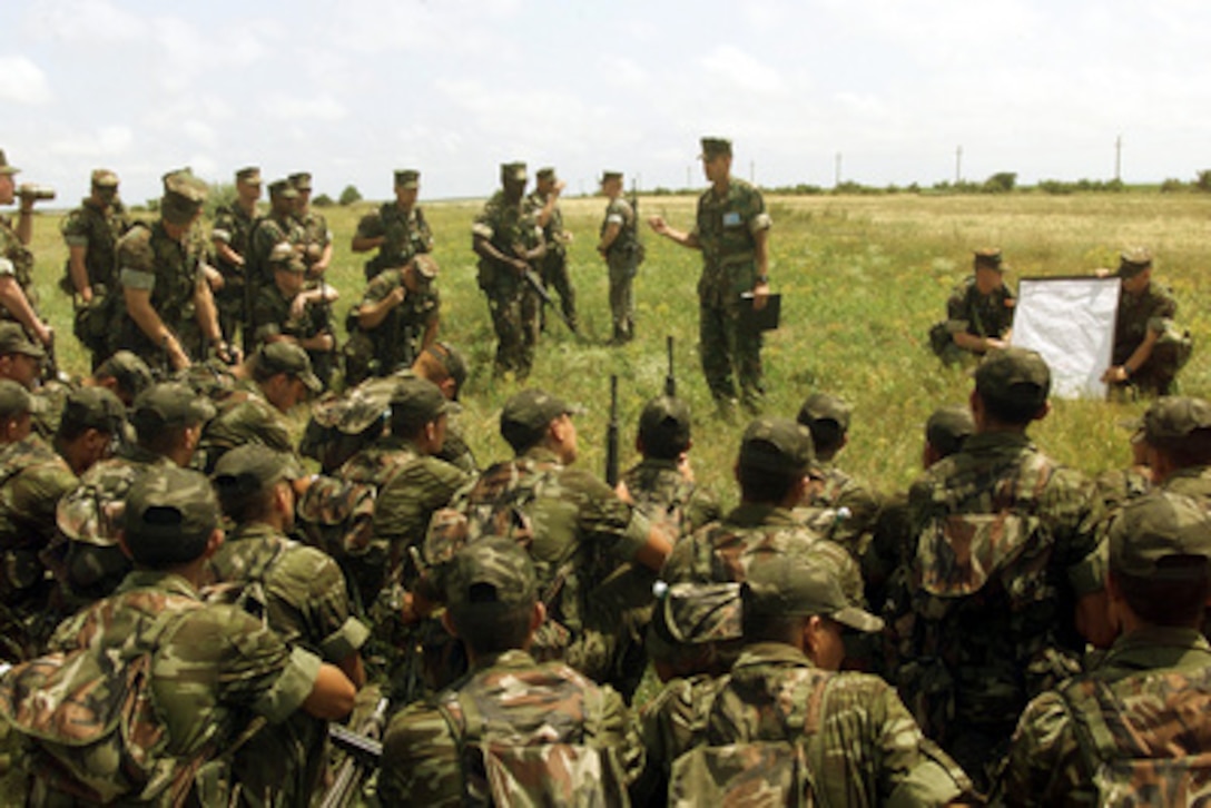 U.S. Marines from the 25th Marine Regiment and members of the Turkish military receive crowd control training during Exercise Rescue Eagle 2000 at Babadag Range, Romania, on July 12, 2000. Rescue Eagle 2000 is a Romanian-hosted joint and combined exercise designed to improve the abilities of multi-national forces to conduct peacekeeping, search and rescue, humanitarian assistance and disaster relief missions. Forces from Azerbaijan, Bulgaria, Georgia, France, Germany, Greece, Hungary, Italy Moldovia, Romania, Slovakia, Turkey and the United States are participating in the exercise. 