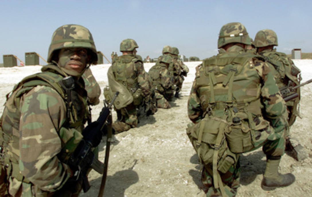 Sgt. Ronnie Guerra and other U.S. Marines from Golf Company, 25th Marine Regiment, prepare for a simulated attack on Vadu Beach, Romania, during Exercise Rescue Eagle 2000, on July 12, 2000. Rescue Eagle 2000 is a Romanian-hosted joint and combined exercise designed to improve the abilities of multi-national forces to conduct peacekeeping, search and rescue, humanitarian assistance and disaster relief missions. Forces from Azerbaijan, Bulgaria, Georgia, France, Germany, Greece, Hungary, Italy Moldovia, Romania, Slovakia, Turkey and the United States are participating in the exercise. 