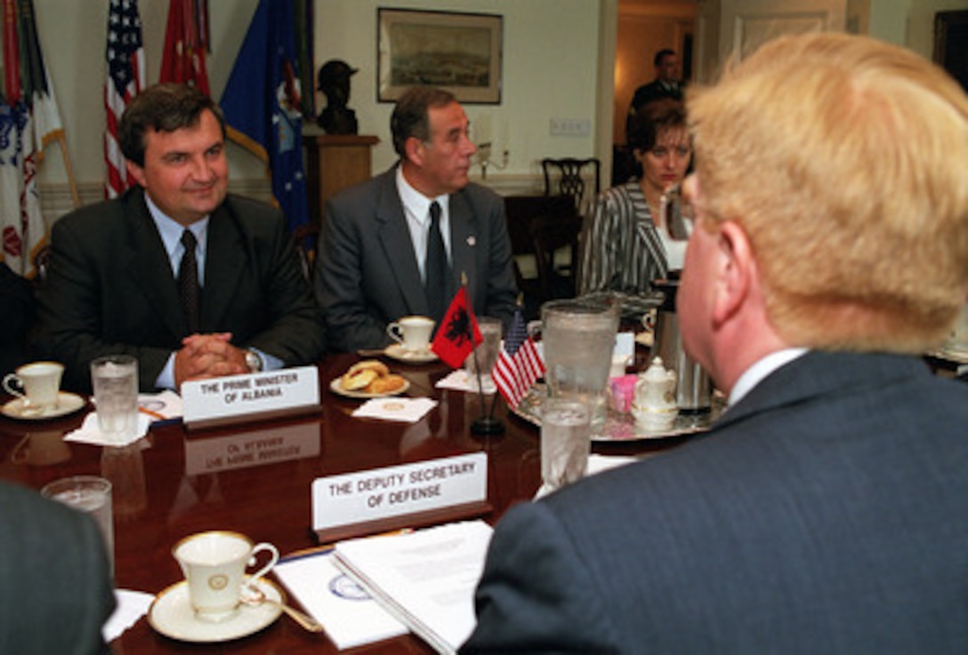 Albanian Prime Minister Ilir Meta (left) meets in the Pentagon with Deputy Secretary of Defense Rudy de Leon (right) on Aug. 24, 2000, to discuss regional security issues. 