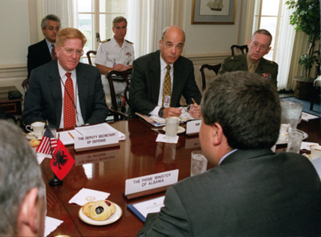Deputy Secretary of Defense Rudy de Leon (left) meets with Albanian Prime Minister Ilir Meta (foreground) in the Pentagon on Aug. 24, 2000, to discuss regional security issues. Joining de Leon and Meta in the security talks are Assistant Secretary of Defense for International Security Affairs Frank Kramer (center) and Brig. Gen. James Mattis (right), U.S. Marine Corps, senior military assistant to de Leon. 