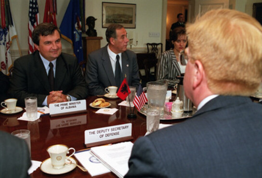 Albanian Prime Minister Ilir Meta (left) meets in the Pentagon with Deputy Secretary of Defense Rudy de Leon (right) on Aug. 24, 2000, to discuss regional security issues. 