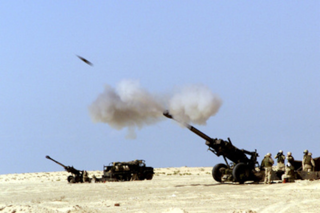 A 155 mm artillery shell hurtles out of the barrel of a 11th Marine Regiment M-198 howitzer during live fire and maneuver training on Nov. 20, 2000, at the Al Hamra Training Area in the United Arab Emirates. U.S. Marines from the 13th Marine Expeditionary Unit (Special Operations Capable) are deployed from the USS Tarawa (LHA 1) to the training area for Exercise Iron Magic. 