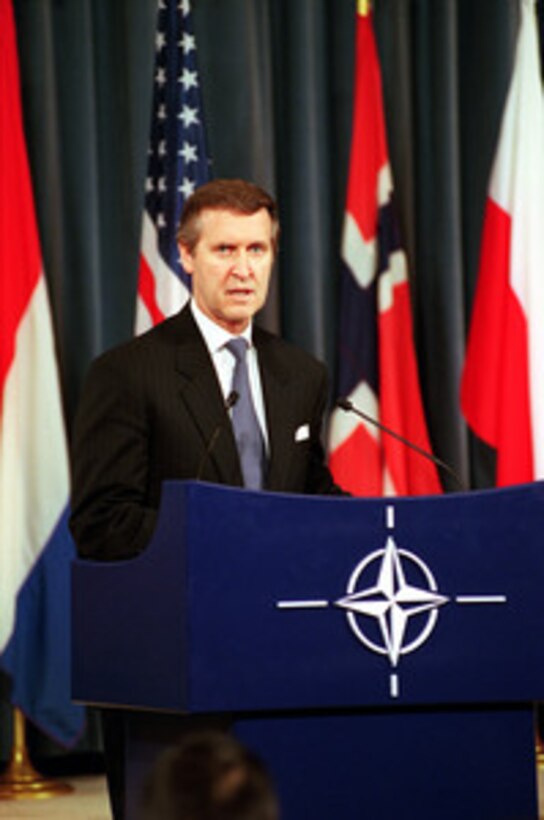Secretary of Defense William S. Cohen responds to a reporter's question during a press conference at NATO Headquarters in Brussels, Belgium, on Dec. 5, 2000. This is Cohen's last scheduled trip to NATO Headquarters as defense secretary. 