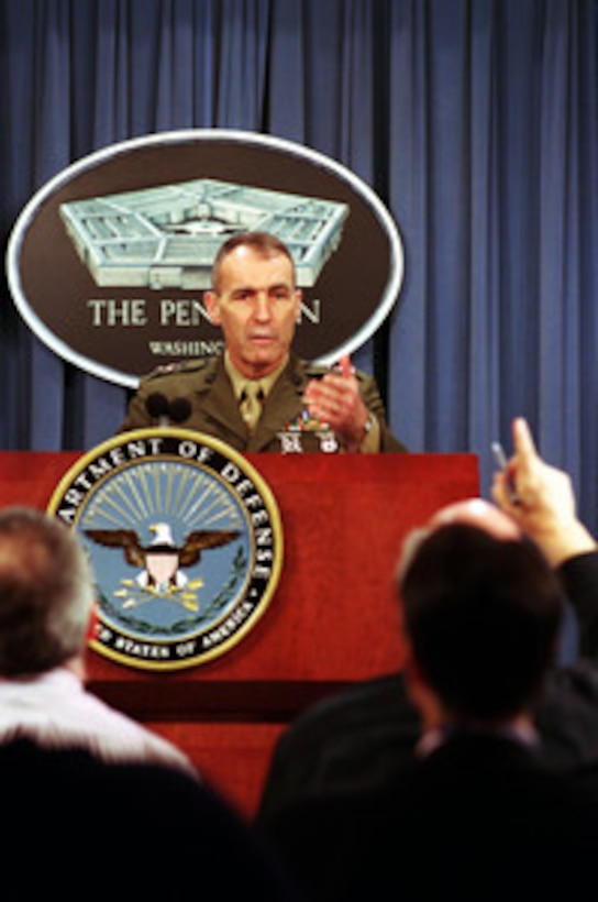 Deputy Commandant of the Marine Corps for Aviation Lt. Gen. Fred McCorkle acknowledges a reporter during a Dec. 12, 2000, Pentagon press briefing on the Dec. 11th crash of a Marine MV-22 Osprey. McCorkle announced the suspension of MV-22 Osprey flight operations pending the accident investigation. 