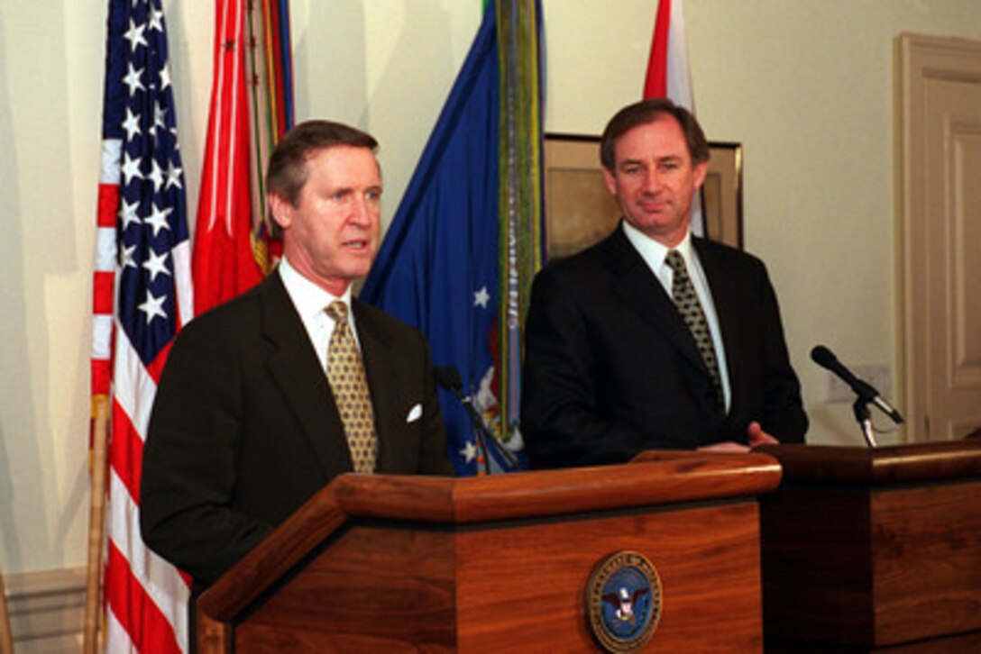 Secretary of Defense William S. Cohen (left) responds to a reporter's question during a media availability with Secretary of State for Defence Geoffrey Hoon, of the United Kingdom of Great Britain and Northern Ireland, in the Pentagon on Jan. 26, 2000. Cohen and Hoon met earlier to discuss a range of bilateral and regional security issues. 