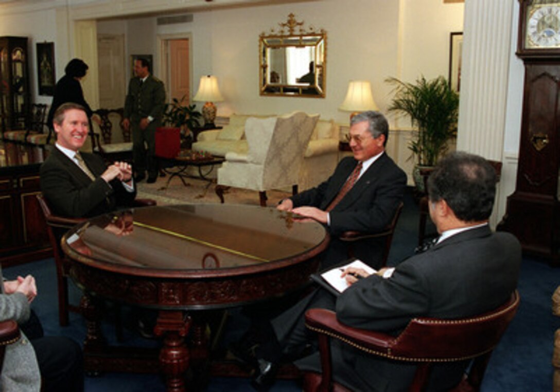 Secretary of Defense William S. Cohen (left) meets informally in his Pentagon office with Tunisian Minister of Defense Mohamed Jegham (center) and the Tunisian Ambassador Noureddine Mejdoub (right) on Jan. 27, 2000. The two defense leaders and their senior advisors will participate in a plenary session to discuss a range of bilateral and regional security issues. 