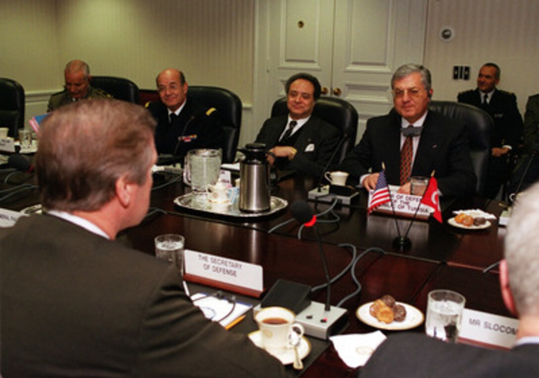 Secretary of Defense William S. Cohen (left foreground) hosts a Pentagon meeting with Minister of Defense Mohamed Jegham (right) of the Republic of Tunisia on Jan. 27, 2000. The two defense leaders and their senior advisors are meeting in a plenary session to discuss a range of bilateral and regional security issues. Accompanying Jegham as part of the Tunisian delegation are (from left): Col.-Maj. Moussa Khalfi, Rear Adm. Mohamed Chedly Cherif, and Ambassador Noureddine Mejdoub. 