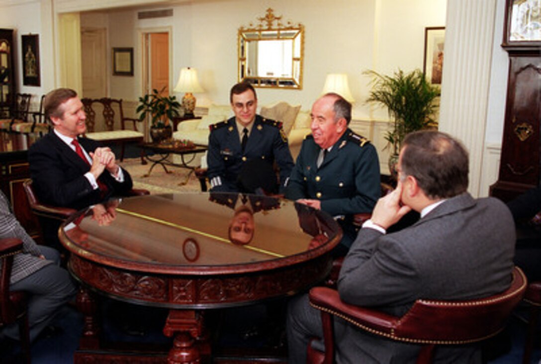 Secretary of Defense William S. Cohen (left) meets informally in his Pentagon office with Mexican Secretary of National Defense Gen. Enrique Cervantes (2nd from right), Mexican Ambassador Jesus Reyes-Heroles (right) and interpreter Lt. Col. Gerardo Wolburg (3rd from right) on Jan. 31, 2000. The two defense leaders and their senior advisors will later meet in a plenary session to discuss a range of bilateral and regional security issues. 