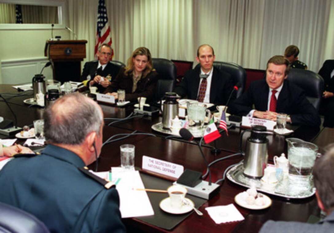 Secretary of Defense William S. Cohen (right) hosts a Pentagon plenary session with Mexican Secretary of National Defense Gen. Enrique Cervantes (left) on Jan. 31, 2000. The two defense leaders and their senior advisors are meeting to discuss a range of bilateral and regional security issues. From left to right are Vice Adm. Gregory Johnson, senior military assistant to the secretary of defense; Deputy Assistant Secretary of Defense For Drug Enforcement Policy Ana Maria Salazar, and Principal Deputy Under Secretary of Defense For Policy James Bodner. 