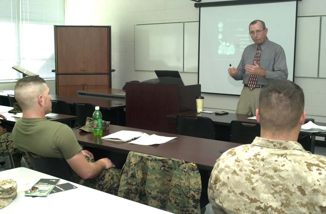 MARINE CORPS BASE CAMP LEJEUNE, N.C. - Roy R. Ells Jr., the Health Promotion Personal Finance Education Specialist for Marine Corps Community Services, explains the purpose of checking a financial institutions background before investing at the Investment Basics class here Nov. 30. The Marine Corp Community Services offers Investment Basics class to help Marines take the first steps in investing and help them on their way an enjoyable retirement. (Official U.S. Marine Corps photo by Lance Cpl. Brandon R. Holgersen)