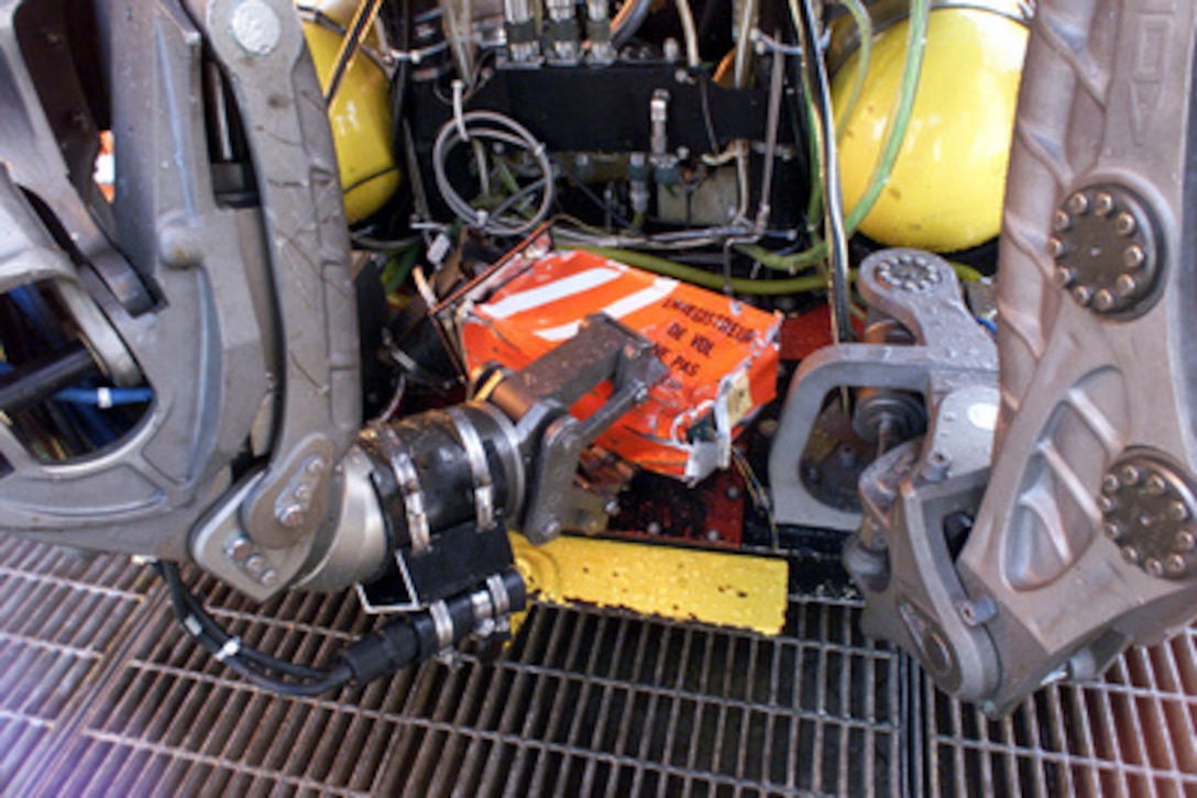 The cockpit voice recorder from the downed Alaska Airlines Flight 261 is held by the robotic arm of the remotely piloted vehicle SCORPIO on the deck of the MV Kellie Chouest off the coast of Ventura County, Calif., on Feb. 2, 2000. The cockpit voice recorder, more commonly called a black box, was located and brought aboard the ship following an 84-minute search by SCORPIO, a tethered unmanned work vehicle from the Navy's Deep Submergence Unit Unmanned Vehicle Detachment. The MV Kellie Chouest is a Military Sealift Command Submarine Support Ship. The search for the aircraft's flight data recorder continues. 