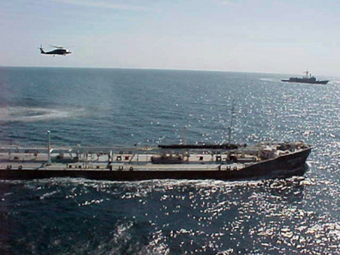 Air and sea assets of the multinational Maritime Interception Force shadow the Russian-flagged tanker Volgoneft-147 on Feb. 3, 2000. The Volgoneft-147 was boarded in international waters on Feb. 2 during interception operations conducted by the Ticonderoga class cruiser USS Monterey (CG 61). While operating under the authority of United Nations Security Council Resolution 665 the multinational Maritime Interception Force routinely intercepts and boards vessels suspected of carrying contraband. 