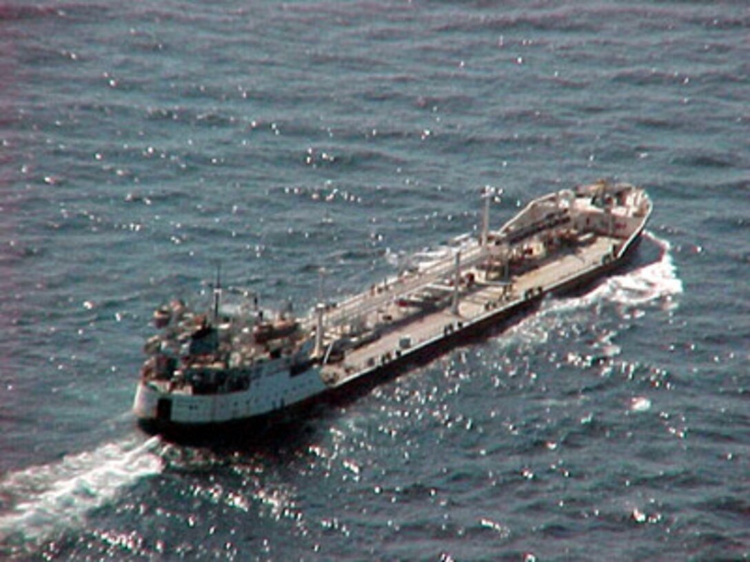 Shadowed by assets of the multinational Maritime Interception Force the Russian-flagged tanker Volgoneft-147 steams on Feb. 3, 2000. The Volgoneft-147 was boarded in international waters on Feb. 2 during interception operations conducted by the Ticonderoga class cruiser USS Monterey (CG 61). While operating under the authority of United Nations Security Council Resolution 665, the multinational Maritime Interception Force routinely intercepts and boards vessels suspected of carrying contraband. 