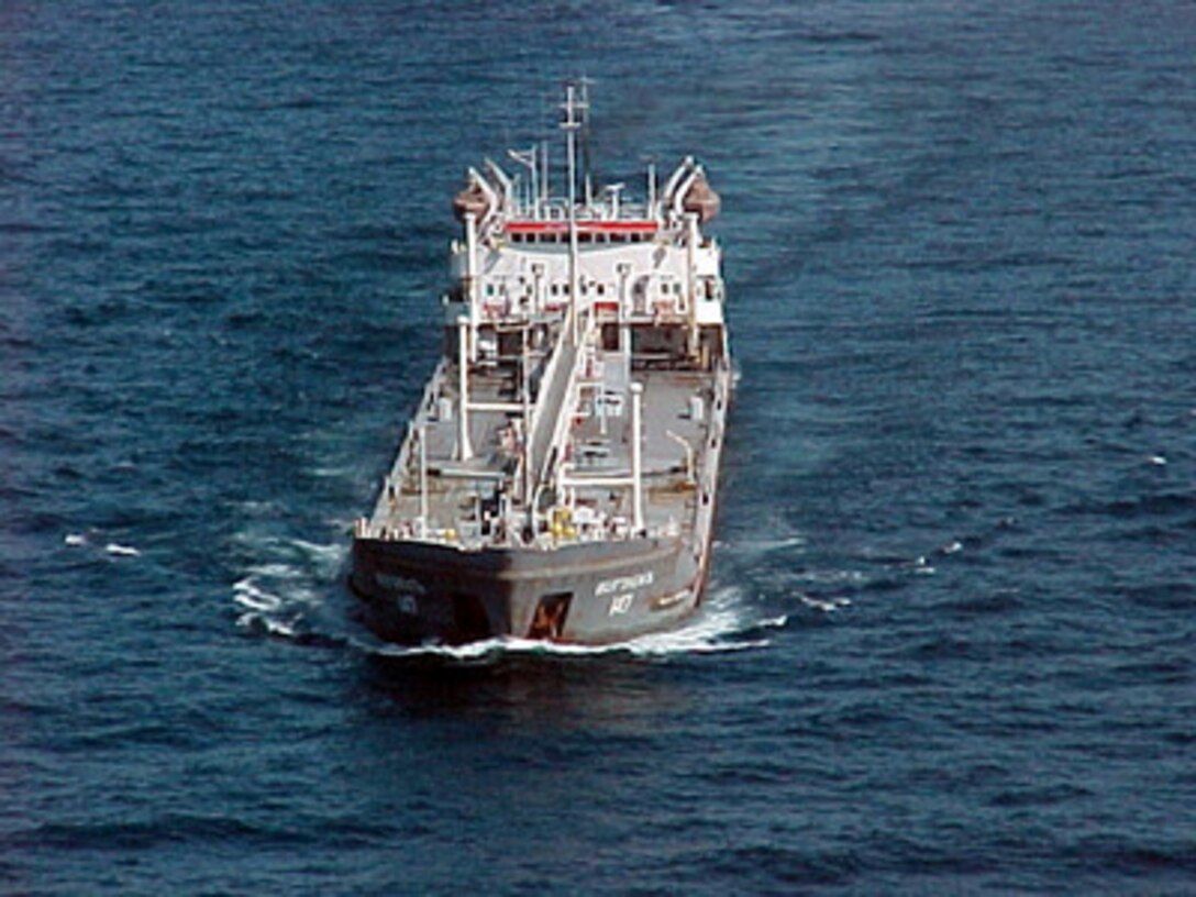 Shadowed by assets of the multinational Maritime Interception Force the Russian-flagged tanker Volgoneft-147 steams on Feb. 3, 2000. The Volgoneft-147 was boarded in international waters on Feb. 2 during interception operations conducted by the Ticonderoga class cruiser USS Monterey (CG 61). While operating under the authority of United Nations Security Council Resolution 665, the multinational Maritime Interception Force routinely intercepts and boards vessels suspected of carrying contraband. 