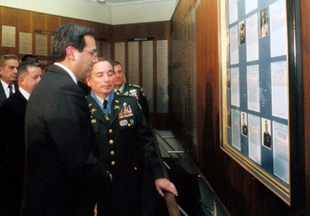 Secretary of the Army Louis Caldera (left) and Alfred Rascon look at a photograph of Rascon and a copy of the citation for his Medal of Honor during Rascon's induction in the Pentagon's Hall of Heroes on Feb. 8, 2000. Rascon was awarded the medal by President Bill Clinton in an earlier ceremony at the White House today. Rascon received the award for gallant and selfless actions during an intense enemy attack in the Long Khanh Province of Vietnam in March 1966. At the time, Rascon was a 20-year-old specialist serving as a medic with the Reconnaissance Platoon, Headquarters Company, 1st Battalion, 503rd Airborne Infantry, 173rd Airborne Brigade (Separate). 