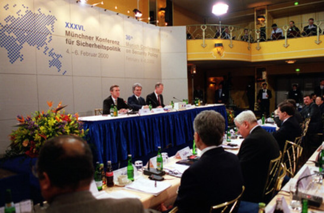 Dr. Horst Teltschik (center), chairman of the Quandt Foundation, introduces the principal speakers of the second session of the 36th Munich Conference on Security Policy, Secretary of Defense William S. Cohen (left) and Minister of Defense of Germany Rudolf Scharping (right) on Feb. 5, 2000, in Germany. 