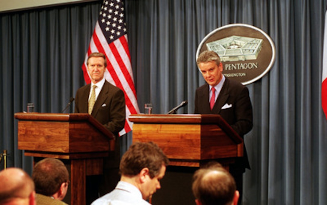 French Minister of Defense Alain Richard (right) responds to a reporter's question during a joint press briefing with Secretary of Defense William S. Cohen (left) in the Pentagon on Feb. 23, 2000. 