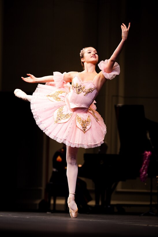 A dancer from the Hawaii State Ballet performs a scene from “The Nutcracker” during the Fourth Annual Na Mele o na Keiki (Music for the Children) Concert at the Neal S. Blaisdell Concert Hall on Dec. 1. The Hawaii State Ballet performed with the U.S. Marine Corps Forces, Pacific Band and local artists, and Marines collected donations to the Marine Corps Reserve’s Toys for Tots Hawaii Program.