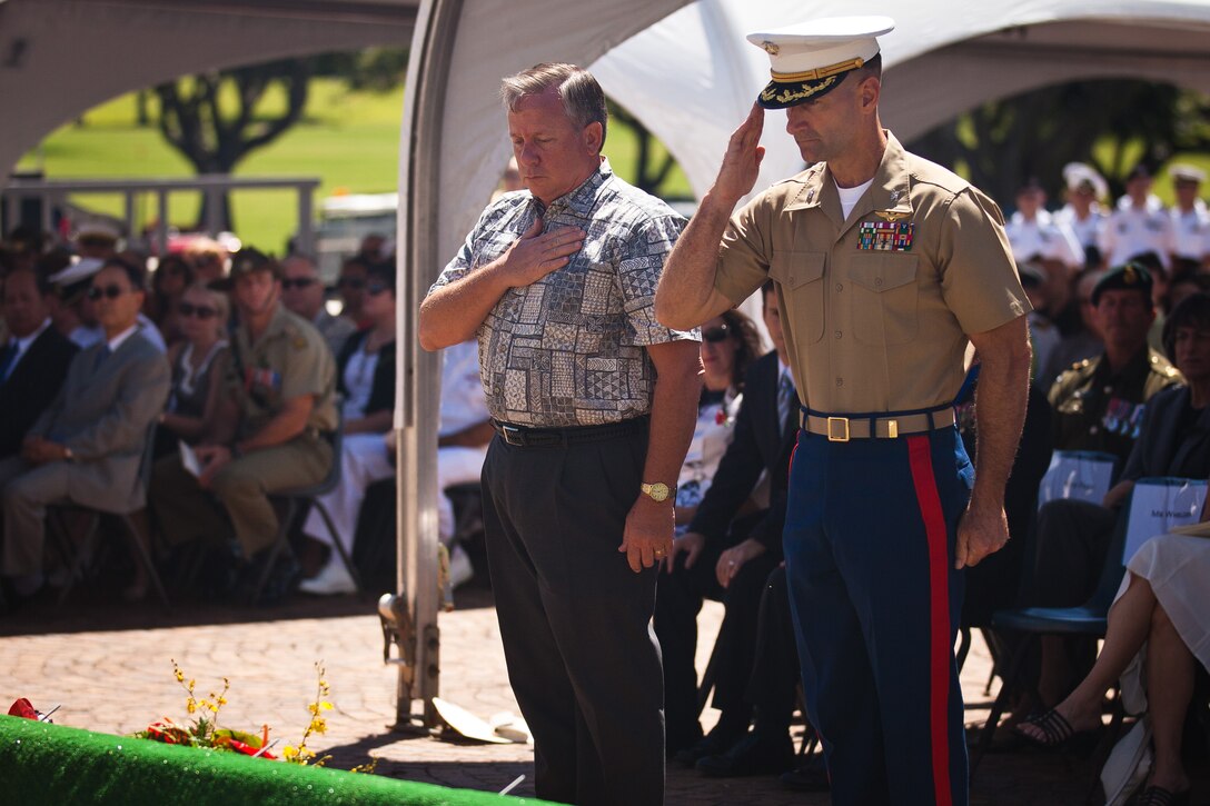 Craig B. Whelden, executive director for U.S. Marine Corps Forces, Pacific, and Col. Jay T. Arnett, deputy chief of staff, MarForPac, salute after laying a wreath in remembrance of all Australia-New Zealand Army Corps soldiers who have given their lives, past and present, at the 40th Annual ANZAC Day ceremony at the National Memorial Cemetery of the Pacific, Punchbowl in Honolulu, April 25. ANZAC day has been observed globally since 1916, the year after nearly 11,000 ANZAC soldiers lost their lives in the Battle of Gallipoli.