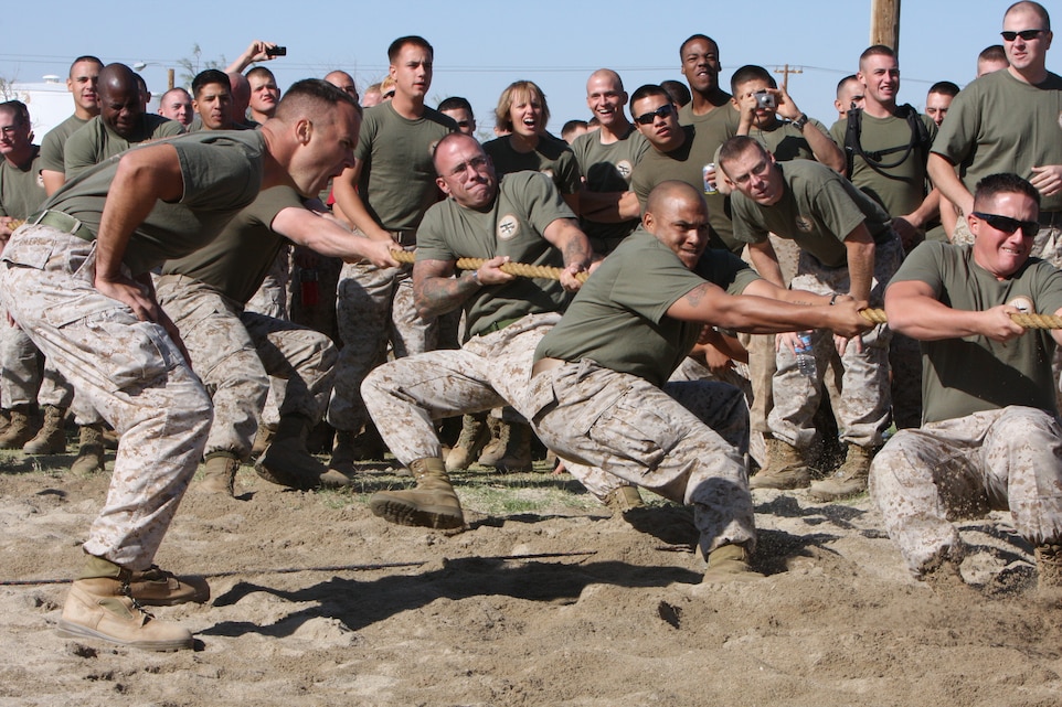 Students and instructors from the Marine Corps Communications-Electronics School compete in a tug-of-war competition on the volleyball court of Victory Field Oct. 10 as part of the culmination of school’ annual field meet. Events included basketball and softball tournaments, a 10-k run, pull up and flex-arm-hang competitions, a Humvee push, and a tug-of-war contest. After each event was completed, each of the school’s four companies was awarded a certain amounts of points depending on where they placed in the event; with the company that received the most total points being declared the overall winner.