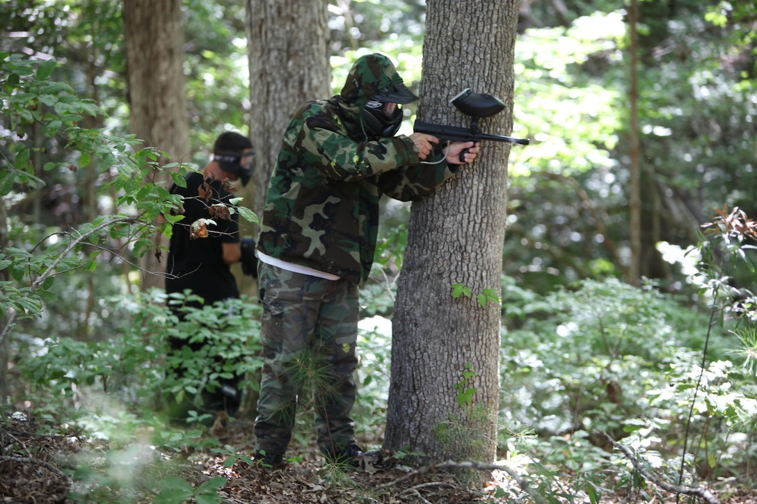 Tony J. Teague fires at an opponent during the Single Marine Program Woods Paintball Tournament at the Piranha Pit at Marine Corps Air Station Cherry Point, Saturday. The SMP offers equipment rentals to include CO2 tanks and paintballs.