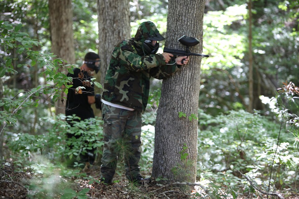 Tony J. Teague fires at an opponent during the Single Marine Program Woods Paintball Tournament at the Piranha Pit at Marine Corps Air Station Cherry Point, Saturday. The SMP offers equipment rentals to include CO2 tanks and paintballs.