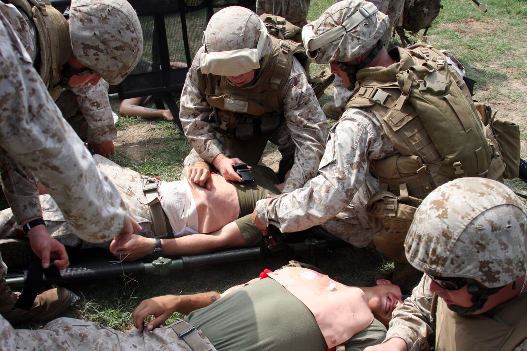 Marines of Headquarters and Support Company, Battalion Landing Team 1st Battalion 9th Marine Regiment and Combat Logistics Battalion 24 form Mass Casualty teams for training on evacuation, evaluation and treatment of wounded personnel during mass casualty drills aboard U.S. Army Base Fort A.P. Hill, Va. Aug. 3 through 7.  (U.S. Marine Corps Photo by LCpl. David J. Beall)