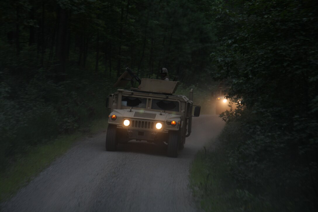 Marines with Combat Logistics Battalion-24, 24th Marine Expeditionary Unit, hone night driving skills in High-Mobility Multipurpose Wheeled Vehicles during convoy operations training at U.S. Army Base Fort A.P. Hill Aug. 12.