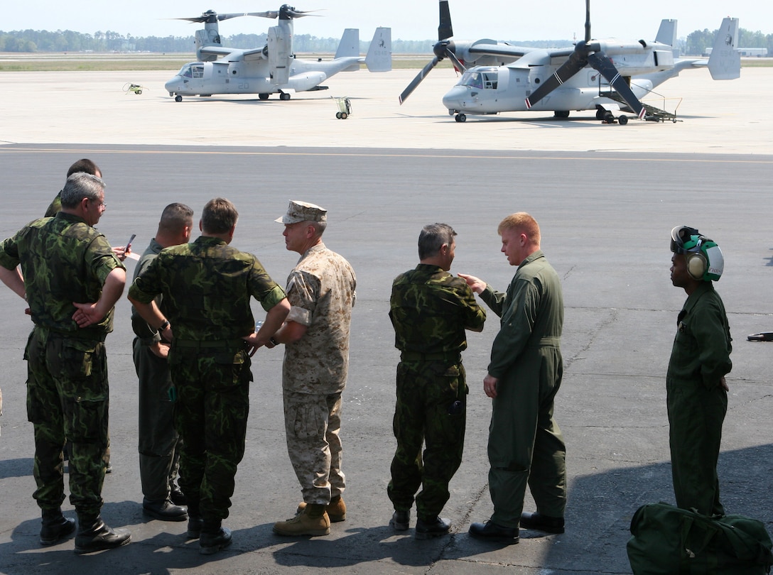 MARINE CORPS AIR STATION NEW RIVER, N.C. - Marines and top military officers from the armed forces of the Czech Republic view a pair V-22 Ospreys on the tarmac April 20.  The delegation of top Czech officers viewed training and capabilities of II Marine Expeditionary Force with Lt. Gen. James Amos, commanding general II MEF, (pictured in desert digital camouflage) during a recent visit to the United States.  The Czech Republic's military forces have deployed in support of the U.S. and allied operations in Afghanistan, the Balkans and Iraq during the past decade.  (Official U.S. Marine Corps photo by Cpl. Ruben D. Maestre)