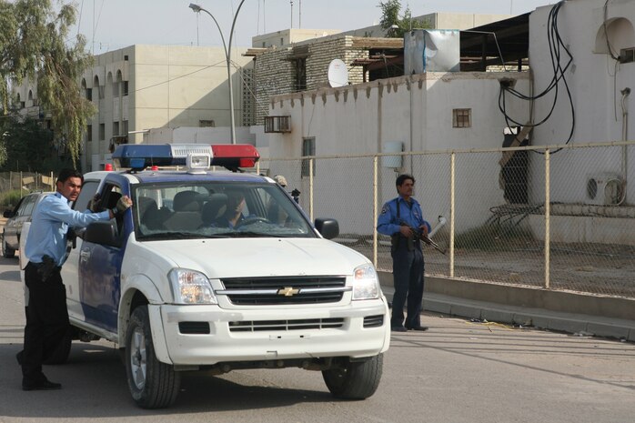 FERRIS, Iraq – Iraqi Security Forces set up a cordon in the streets of Ferris, Iraq, to search the area f during a joint operation with Marines from Weapons Company, 1st Battalion, 4th Marine Regiment, Regimental Combat Team 1. (Official Marine Corps photo by Cpl. Chris T. Mann)(Released)