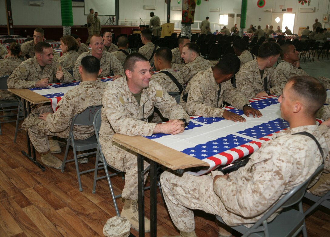 Marines, sailors and civilians with II Marine Expeditionary Force Headquarters Group (Forward) gather in the great room at the Morale, Welfare and Recreation center aboard Al Asad Air Base, Iraq, for an “end in sight” luncheon, Dec. 19, 2009. During the luncheon, Marines shared memories and stories of their deployment and talked about their plans for returning to the U.S.