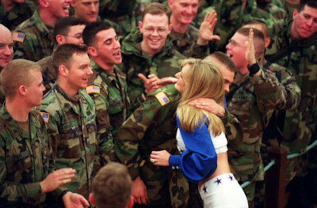 U.S. Army soldiers are giddy with anticipation as they wait to