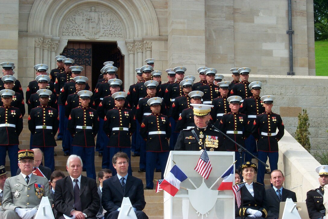 BELLEAU, France ? General Michael W. Hagee, Commandant of the Marine Corps, addresses the hundreds in attendance at the Aisne-Marne American Cemetery here, May 28, during the commemoration of the Battle of Belleau Wood. The ceremony also included lying of wreaths and performances by the U.S. Marine Drum and Bugle Corps and Silent Drill Platoon based at Marine Barracks, Washington, D.C.