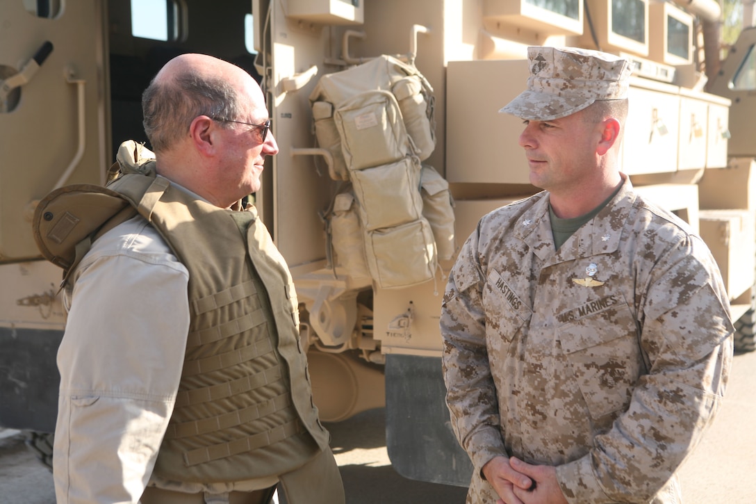 Secretary of the Navy Donald C. Winter meets with Lt. Col. Chris Hastings, commanding officer, 1st Battalion, 4th Marine Regiment, Regimental Combat Team 1, at Camp Baharia in Fallujah, Iraq, Nov. 27. (Official Marine Corps photo by Cpl. Chris T. Mann)::r::::n::(Released)::r::::n::