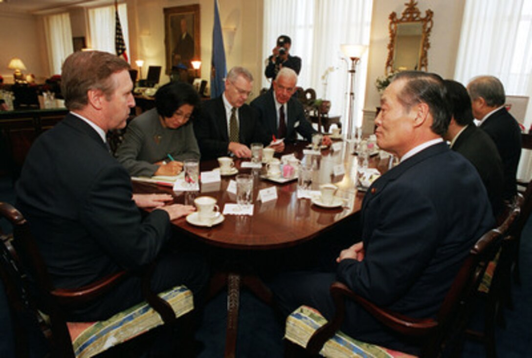 Secretary of Defense William S. Cohen (left) and Director General Tsutomu Kawara (right), of the Japan Defense Agency, meet with senior advisors and ambassadors at the Pentagon on Jan. 5, 2000. Under Secretary of Defense for Policy Walter Slocombe (3rd from left), Ambassadors Thomas Foley (4th from left) of the U.S. and Shunji Yanai (far right), of Japan, as well as the two interpreters, joined Cohen and Kawara in discussing a range of regional and global security issues. 