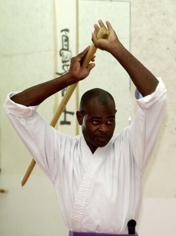 MARINE CORPS BASE CAMP LEJEUNE, N.C. - Sgt. Izaya Dunn, the current instructor of the dojo, practices with his wooden sword while teaching a class. The Dragon Fly dojo is free to all active duty military members, family members and civilian employees of the base. (Official U.S. Marine Corps photo by Lance Cpl. Brandon R. Holgersen)