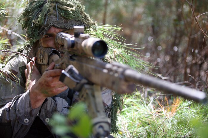 Staff Sgt. Mark L. Reidel, a team leader with 2nd Reconnaissance Battalion, 2nd Marine Division, prepares to take a shot during the Pre-sniper Course here March 18. Becoming a scout sniper is just one of the many challenges Reidel has taken on in his career. (Official U.S. Marine Corps photo by Lance Cpl. Brian M. Woodruff)