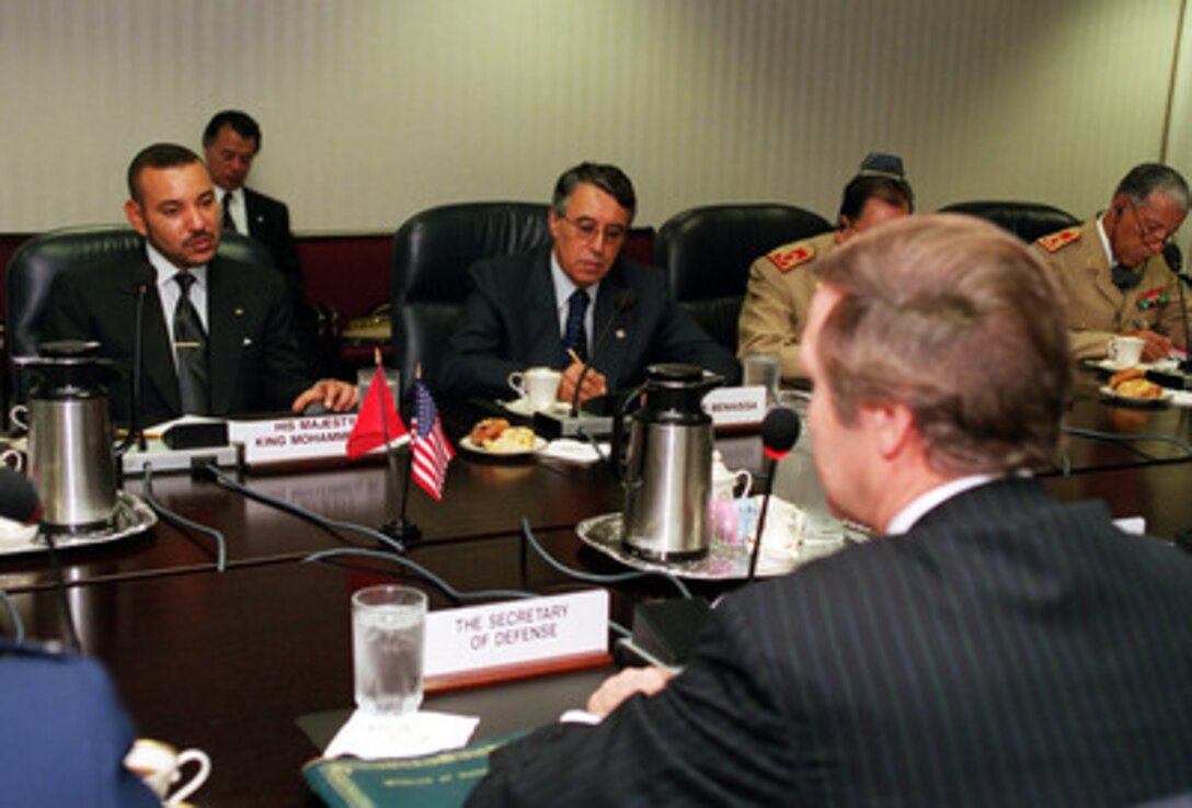 His Majesty King Mohamed VI of Morocco (left) meets in the Pentagon with Secretary of Defense William S. Cohen (foreground) on June 21, 2000. The two men are meeting to discuss a range of security issues, both regional and global, of mutual interest to both nations. Seated to the right of the King is the Moroccan Minister of Foreign Affairs Mohamed Benaissa. 