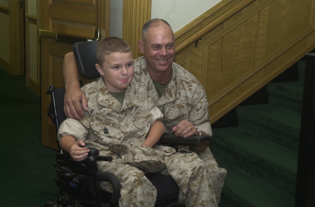 MARINE CORPS BASE CAMP LEJEUNE, N.C. - Hunter Box (left) poses with Maj. Gen. Robert C. Dickerson, the commanding general for MCB Camp Lejeune here June 29. Box, 11, from Dunlap, Tenn., joined the ranks of the few and the proud June 28 after being bestowed the title of Honorary Marine by Maj. Gen. Robert Dickerson, the Marine Corps Base commanding general at building one. (Official U.S. Marine Corps photo by Lance Cpl. Brandon R. Holgersen)