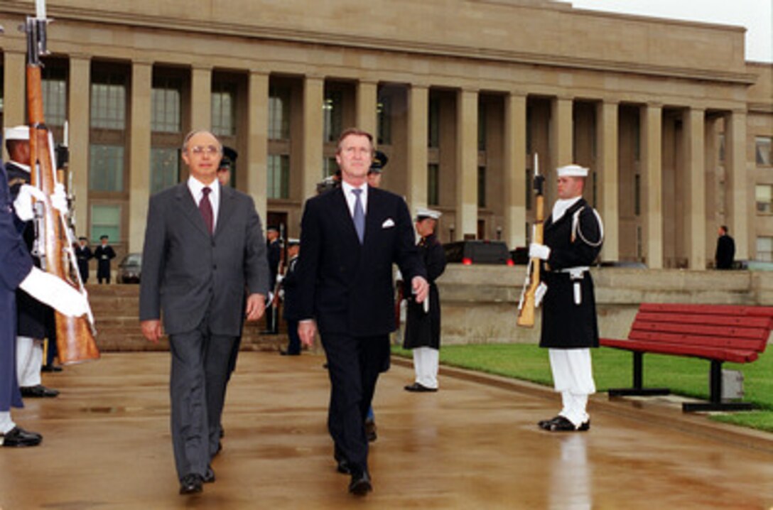 Brazilian Minister of Defense Geraldo Magela Quintao Alvares (left) is escorted by Secretary of Defense William S. Cohen (right) to the Pentagon River parade field for his welcoming ceremony on June 28, 2000. This is the first visit by the new position of Brazilian Minister of Defense. 